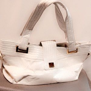White patent handbag